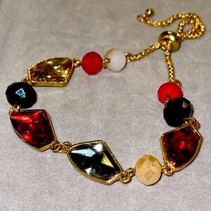 Vintage Gold Tone Bracelet with Black/Red Faux Gems.